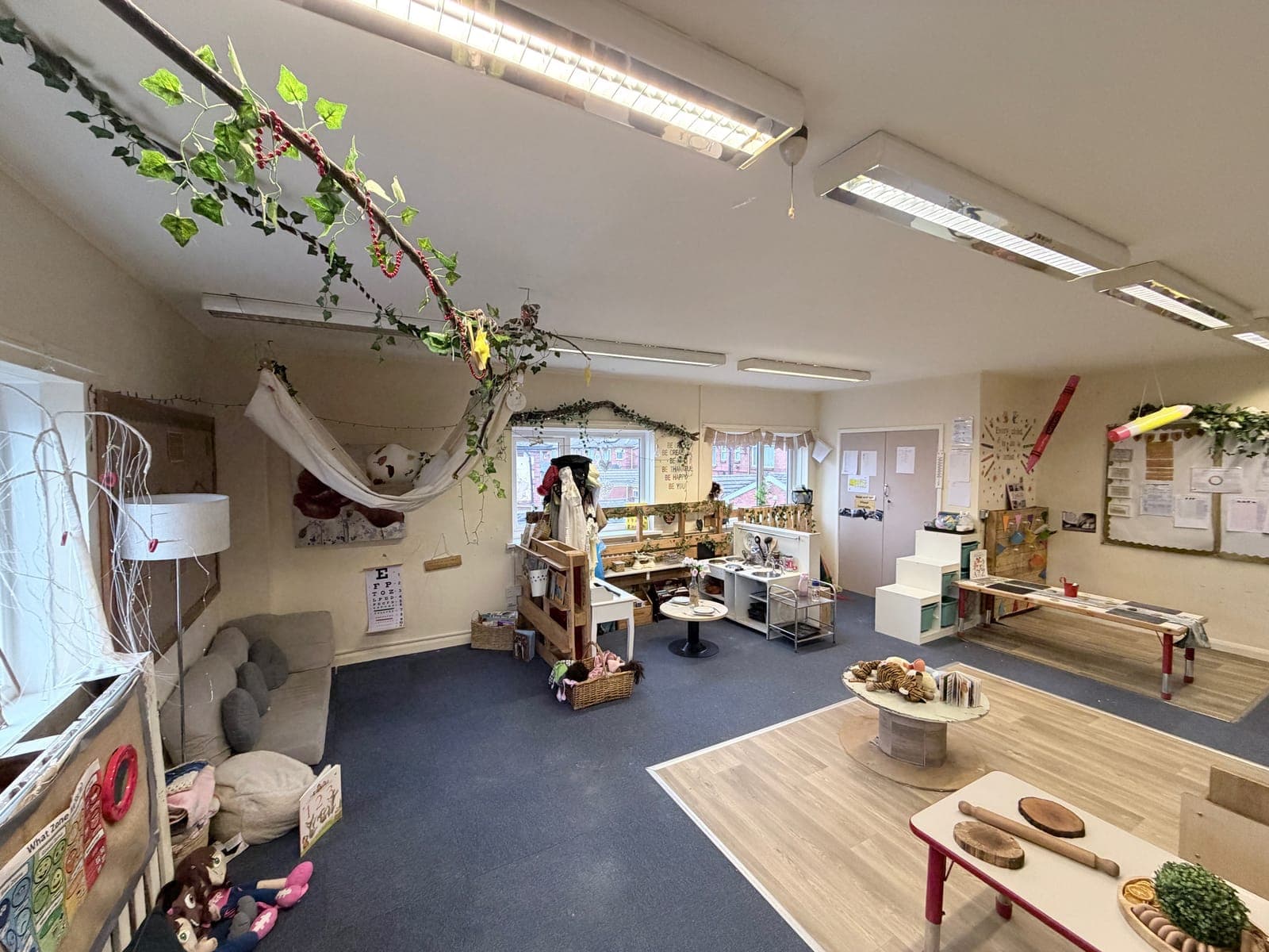Children exploring with natural materials in the curiosity room